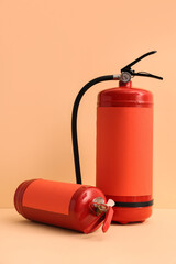 Naklejka premium Fire extinguishers on beige background
