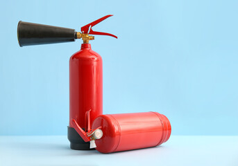 Fire extinguishers on blue background