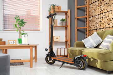 Interior of bedroom with electric scooter and sofa