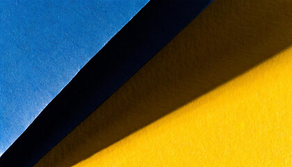 Vibrant blue and yellow paper textures divided by a shadow, ideal for backgrounds, elegant designs, or artistic presentations, invitations, luxury packaging, or stationery mockups
