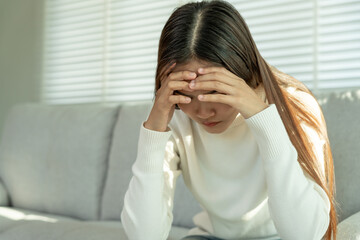 Depression and mental illness. Asian woman disappointed, sad after receiving bad news. Stressed girl confused with unhappy problems, arguing with boyfriend, cry and worry about unexpected pregnancy.