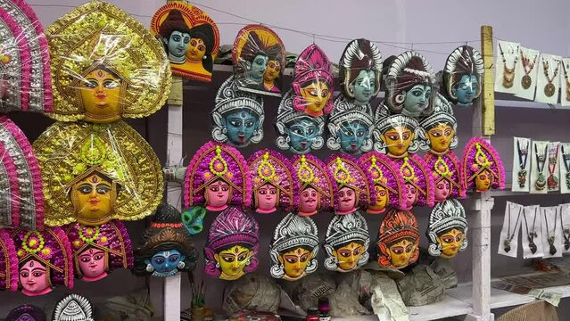 Panorama shot of various facemasks being displayed at roadside stall in Purulia, India