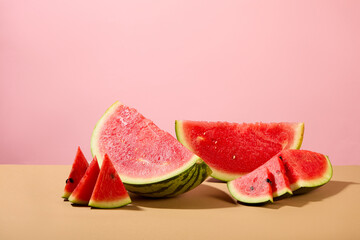 Watermelon with eye-catching bright red color on a pink background. The vitamin C content in watermelon is very high, which helps strengthen the immune system by maintaining the integrity of cells.