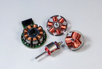 A close-up of a group of different electronic motor rotors on a white background
