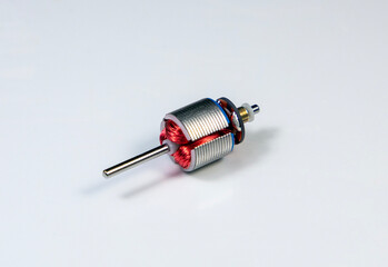 A close-up of an electronic motor rotor on a white background