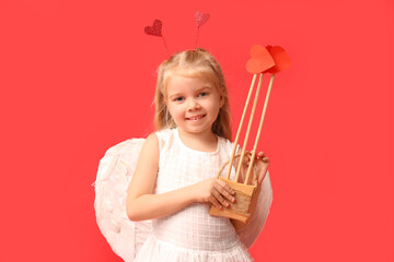 Cute little girl dressed as cupid with arrows on red background. Valentine's Day celebration