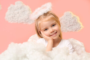 Cute little girl dressed as cupid with clouds on pink background. Valentine's Day celebration