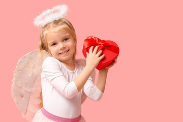 Cute little girl dressed as cupid with heart-shaped gift box on pink background. Valentine's Day celebration