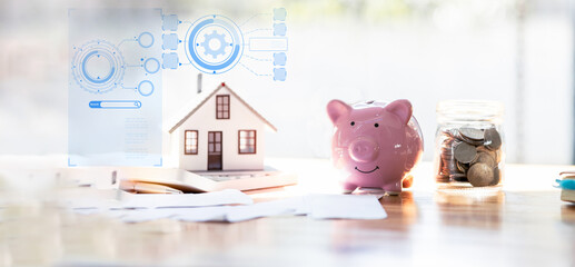 house model and money coins saving for concept saving money for buying a house, investment mortgage finance, and home loan refinance financial plan home loan.	