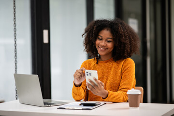 Businesswoman talking to customers online together at the office.