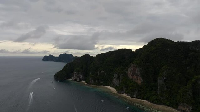 Drone footage from PhiPhi islands in Thailand footage of incredible Thai landscapes incredible nature with insane rocks, beaches, hills, ocean adn boats. Footage. filmed in 4k