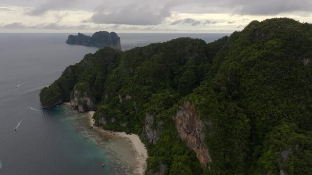 Drone footage from PhiPhi islands in Thailand footage of incredible Thai landscapes incredible nature with insane rocks, beaches, hills, ocean adn boats. Footage. filmed in 4k