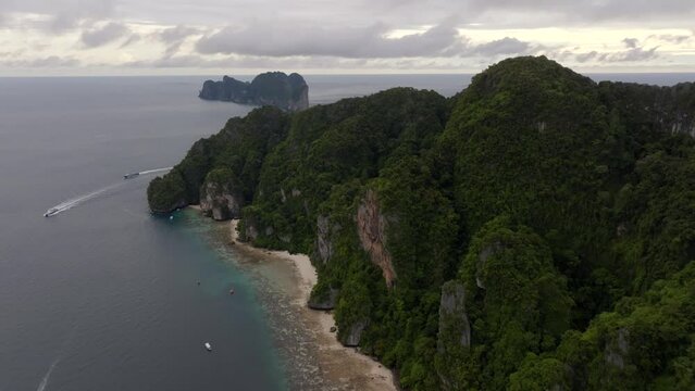 Drone footage from PhiPhi islands in Thailand footage of incredible Thai landscapes incredible nature with insane rocks, beaches, hills, ocean adn boats. Footage. filmed in 4k