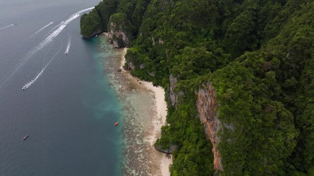 Drone footage from PhiPhi islands in Thailand footage of incredible Thai landscapes incredible nature with insane rocks, beaches, hills, ocean adn boats. Footage. filmed in 4k
