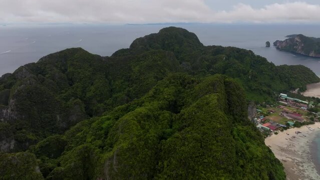Drone footage from PhiPhi islands in Thailand footage of incredible Thai landscapes incredible nature with insane rocks, beaches, hills, ocean adn boats. Footage. filmed in 4k