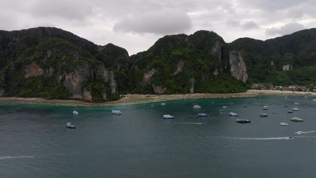 Drone footage from PhiPhi islands in Thailand footage of incredible Thai landscapes incredible nature with insane rocks, beaches, hills, ocean adn boats. Footage. filmed in 4k