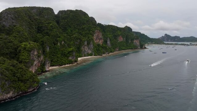 Drone footage from PhiPhi islands in Thailand footage of incredible Thai landscapes incredible nature with insane rocks, beaches, hills, ocean adn boats. Footage. filmed in 4k