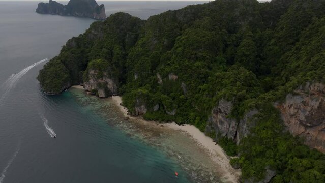 Drone footage from PhiPhi islands in Thailand footage of incredible Thai landscapes incredible nature with insane rocks, beaches, hills, ocean adn boats. Footage. filmed in 4k