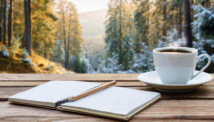Cup of coffee, opened notebook and pencil on wooden table against forest background