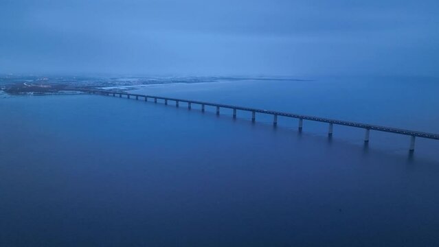 Panoramic Aerial view of Oresund Bridge who is a combined motorway and railway, sea bridge between Denmark and Sweden (Copenhagen and Malmo) and ship - seascape of Baltic Sea, Europe from above