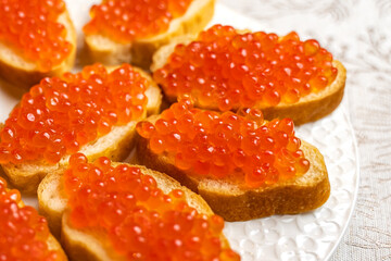 Sandwiches with red caviar. New Year's table. 