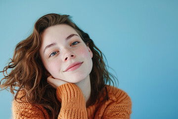 Young woman posing in front of clean background.Copyspace for text.