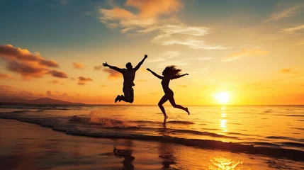 Foto op Plexiglas happy couple running and jumping on the beach at sunset,Silhouette Couples Jumping © kiki__