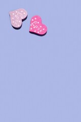 Wooden hearts on a pastel blue background. Concept for Valentine's Day, Mother's Day, World Women's Day. Romantic flat composition.