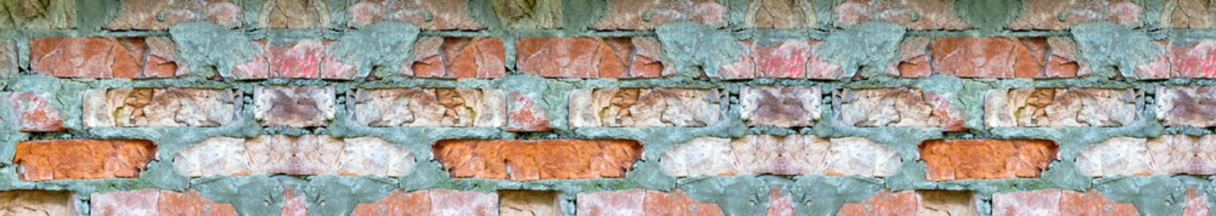 An image of the texture of a brick wall with a coarse-grained, embossed surface. Small cracks and cement inclusions. Horizontal image. Banner for insertion into site. Template for interior design.