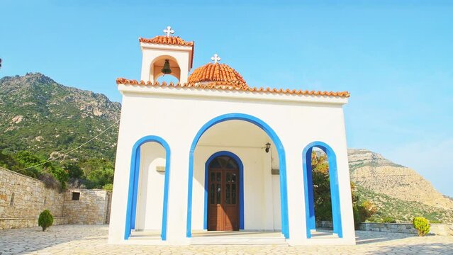 Saint Phanourios, St paraskevi church of Greek christian orthodox religion at Magganitis, Ikaria island, Greece longevity blue zone with bell tower