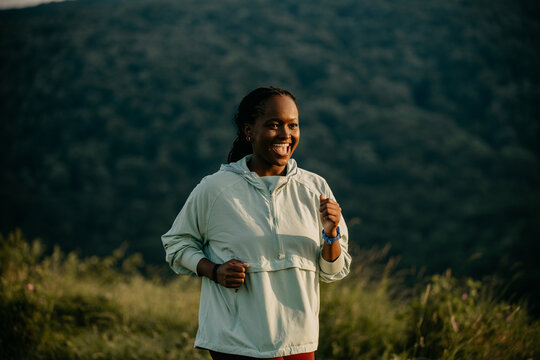 African American woman enjoying a refreshing run in nature
