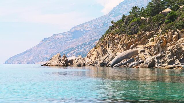 Magganitis fishing village port with moored ships on Ikaria island, Greece at Greek longevity blue zone
