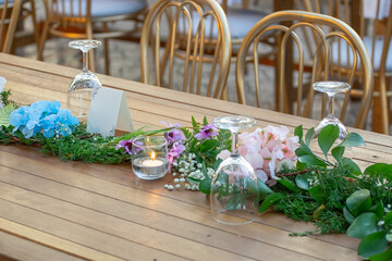 Beautiful flowers decorated on the table.Tables set for an event party or 
wedding reception....