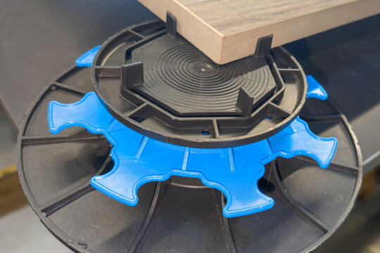 Exterior pavement tiles installation for house terrace with adjustable paving pedestals plots plastic studs