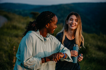  Caucasian and African American women breaking stereotypes, running and tracking progress with...