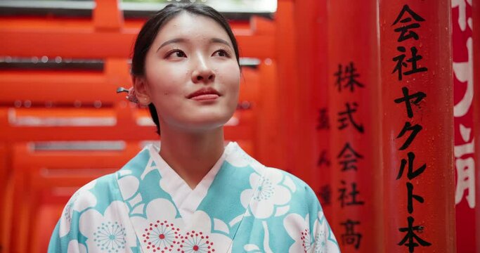 Woman, Japan and kimono or traditional culture at Fushimi Inari, shrine in Kyoto. Female person, temple clothes and path to worship building for spiritual outdoor journey, local tourism or heritage