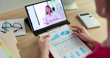 Woman watching business training and online webinar at remote working or distance learning on tablet - Powered by Adobe