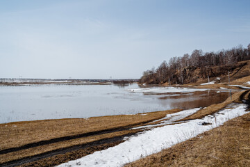 Spring in nature, flooding on the river, flooded crop fields, snow melting, the river overflowing...