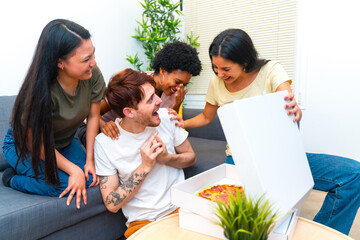 Young multi-ethnic friends receiving a delivery pizza