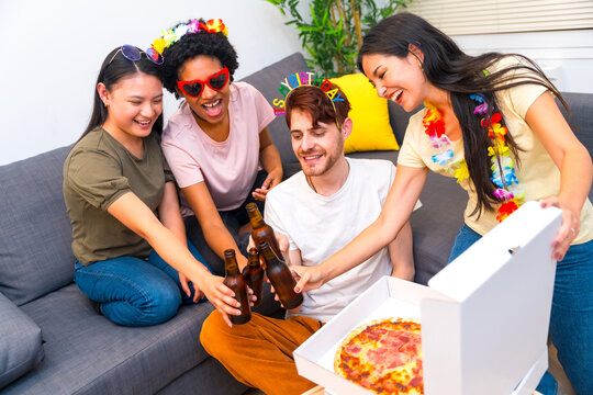 Friends celebrating birthday with pizza and beer