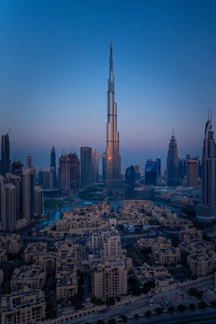 Golden Dawn: Aerial Majesty of Dubai's Skyline Bathed in Sunrise Splendor