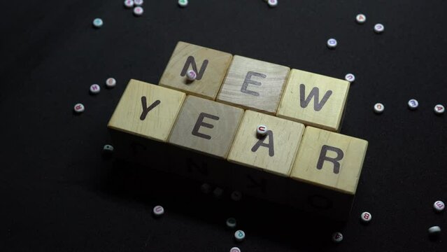 New year writing block looping concept with falling letters