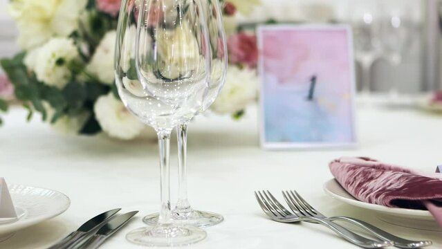 decorated wedding banquet table, wedding table for the wedding, wedding banquet preparation, festive table, cutlery, glasses