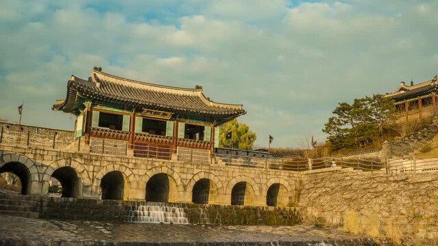 Time lapse, Suwon Hwaseong Fortress, Hwahongmun Gate with clouds flowing beautifully, Zoom out