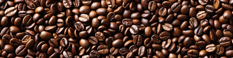  roasted fresh brown coffee beans background banner, top view, International Coffee Day © graphicbeezstock
