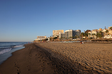  View of Bajondillo Beach and hotels in Torremolinos at sunrise. Costa del Sol, Spain.