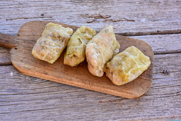 Cabbage rolls with meat, rice and vegetables. Stuffed cabbage leaves with  ground beef. Known as sarma, golubtsy, dolma.