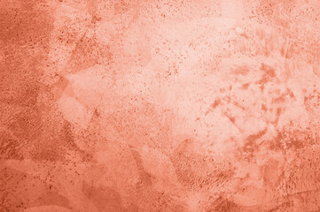 background, texture of concrete and stone in the color of 2024 peach fuzz. High quality photo