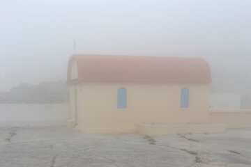 Small, Christian church in the mountains on a winter day