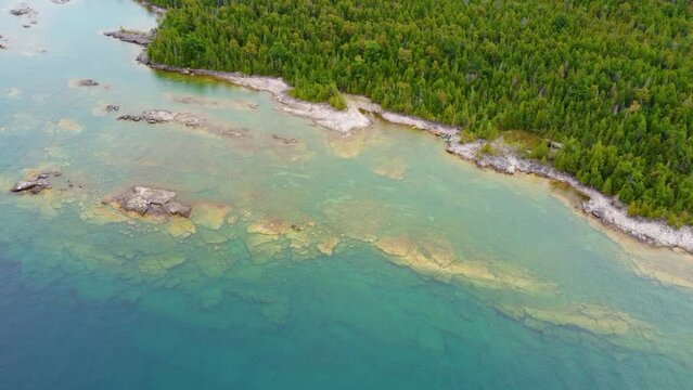 Aerial Drone Fly Above Blue Coastline with Pine Forest of Gregorian Bay Canada Beautiful Panoramic Landscape